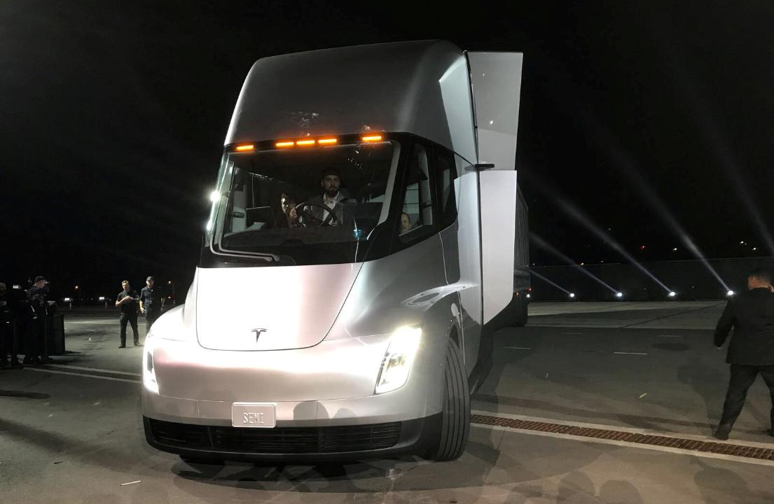 Tesla CEO Elon Musk hopped out of the first fully electric semi truck at SpaceX headquarters, unveiling the Tesla Semi. Musk promised that the truck will help transform the trucking industry and improve safety. Here’s what it’s all about. 