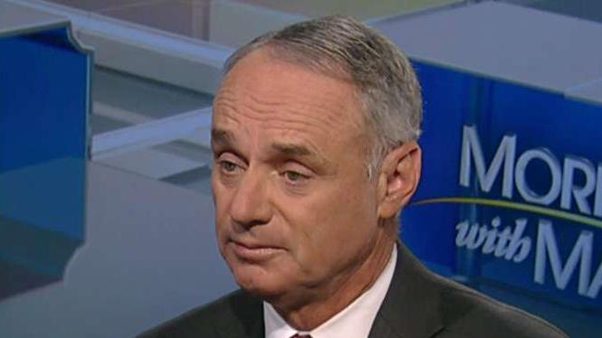 MLB Commissioner Rob Manfred discusses the unintended consequences of the new tax law.