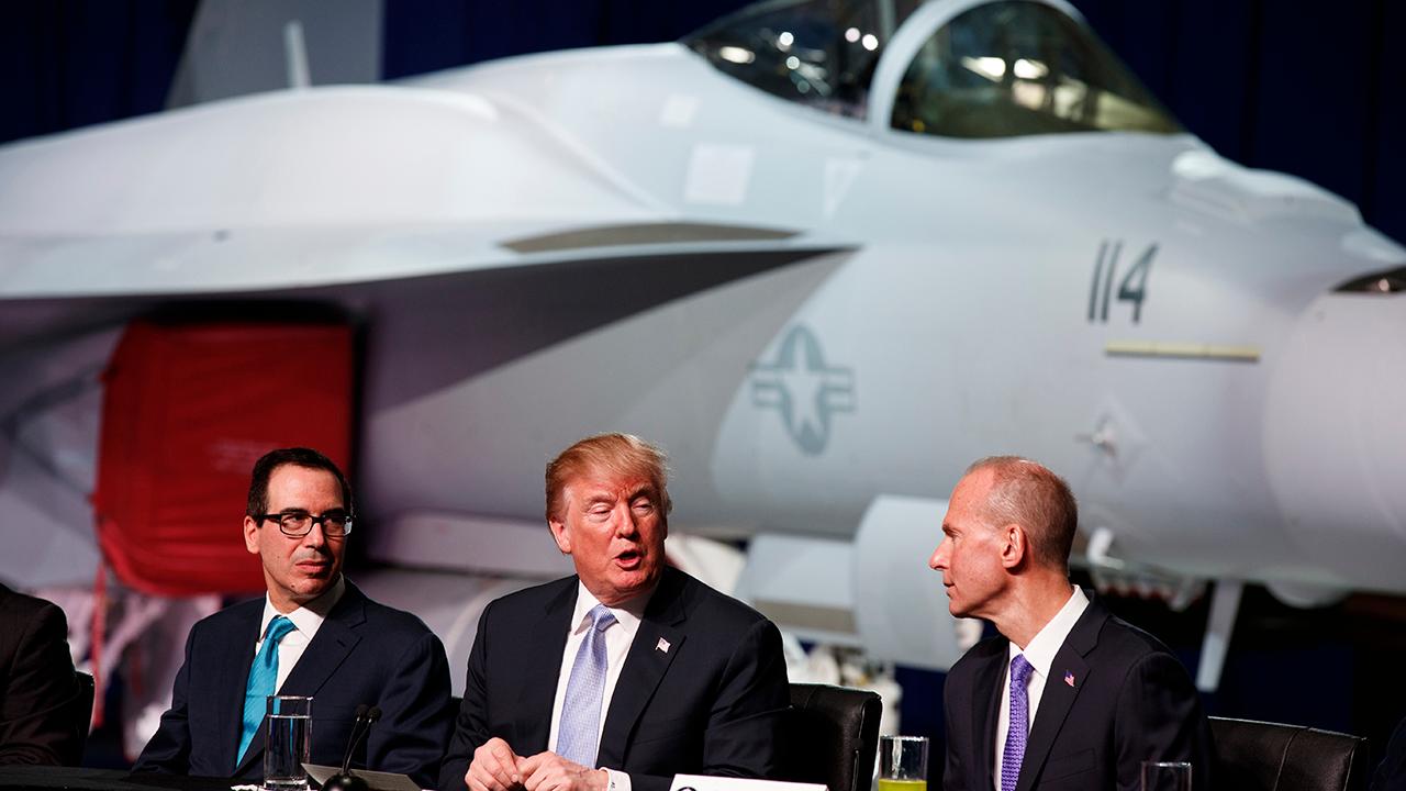 President Trump participates in a roundtable discussion on tax cuts at a Boeing plant in St. Louis, Missouri.