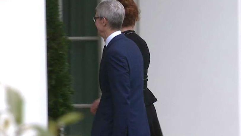 Apple CEO Tim Cook arrives at the White House for a meeting with President Trump.