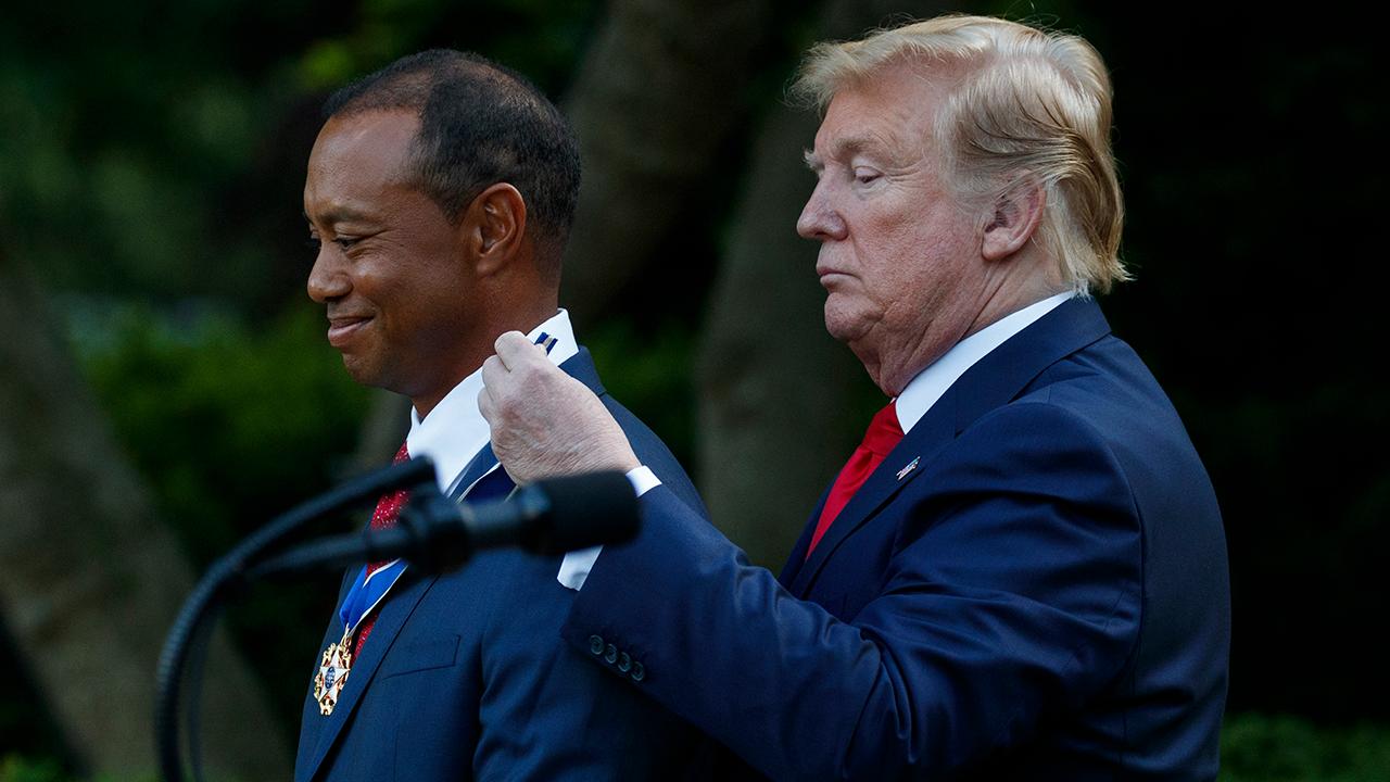 President Trump presents Tiger Woods with the Presidential Medal of Freedom. 