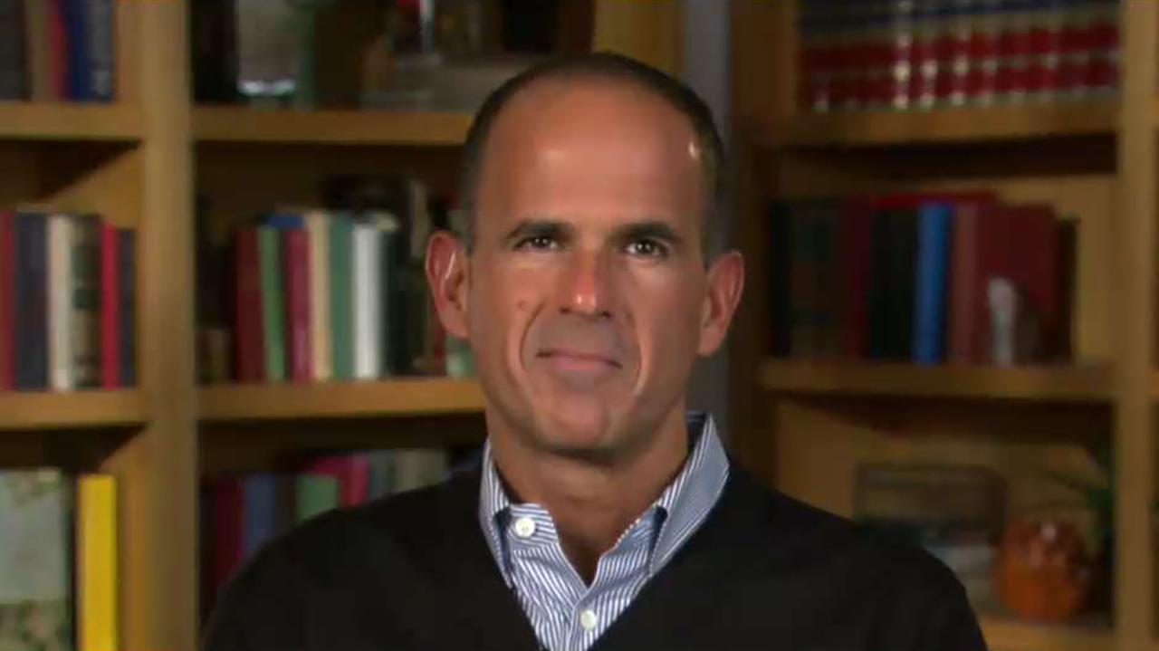 Marcus Lemonis, chairman and CEO of Camping World, says that he won’t take down the large American flag flying above his store, despite a North Carolina city’s lawsuit demanding that he do so.