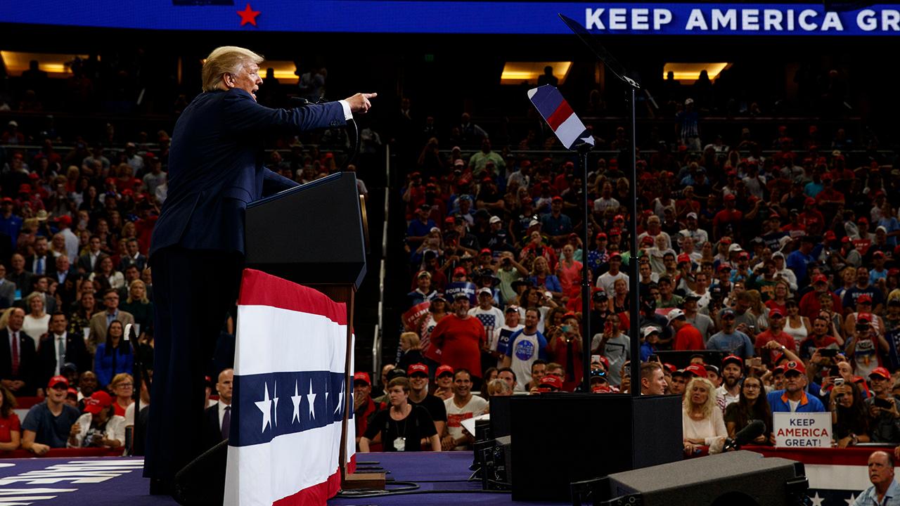 President Trump talks about the U.S.-China trade war during a rally in Orlando, Florida.