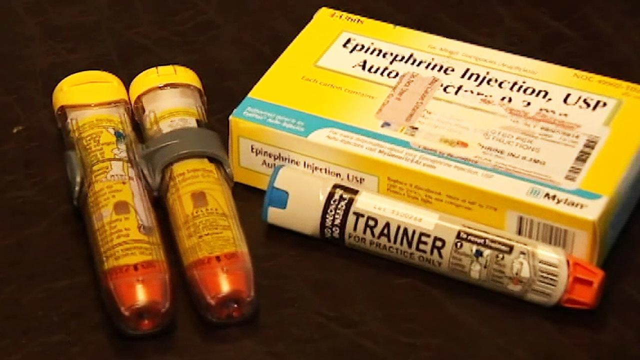 Illinois now requires insurers to cover EpiPens for kids, but there are still questions about whether it will lead to lower costs.