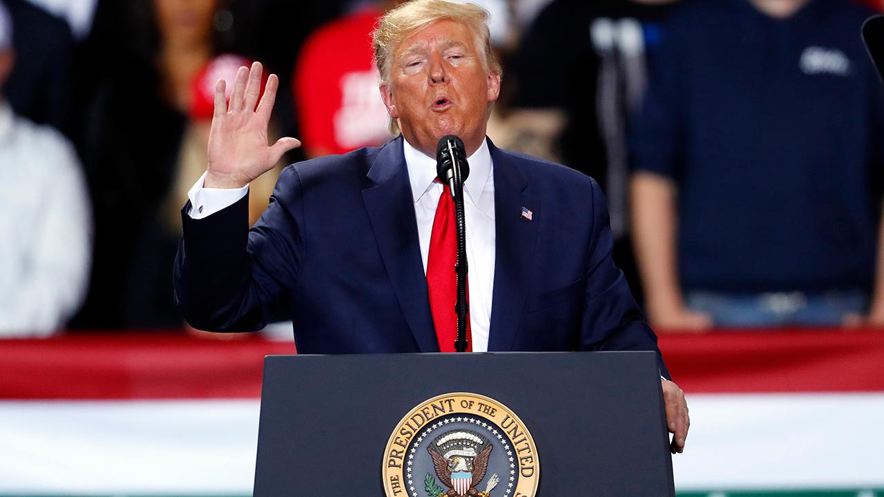 President Trump delivers a speech to his supporters in Battle Creek, Michigan, on the same day the House impeaches him over his Ukraine dealings.