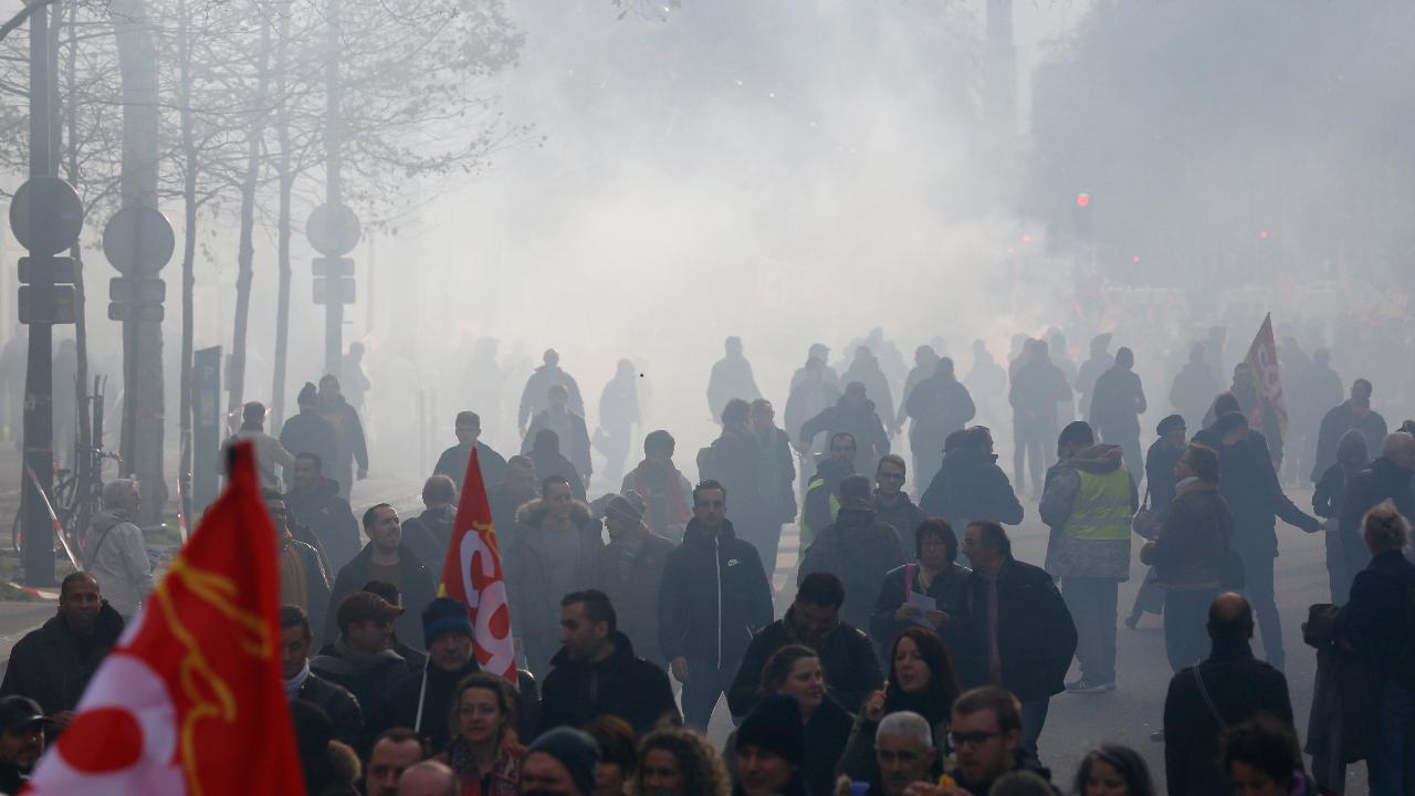 Angry over President Macro's pension overhaul plans, thousands of French take to the streets