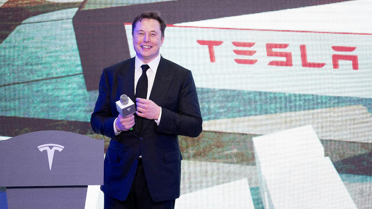 Tesla CEO Elon Musk visits Shanghai plant for the first Model 3 deliveries and breaks out some moves on stage.