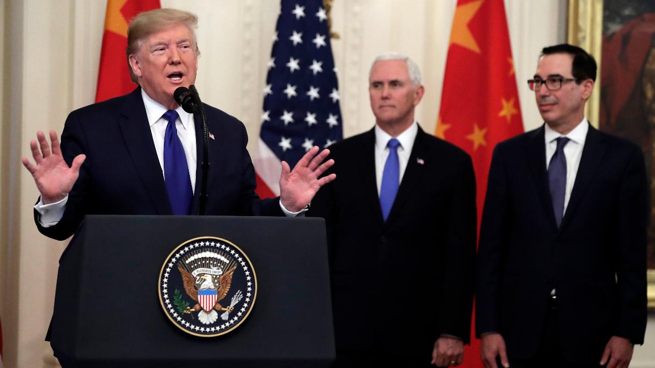 President Trump makes remarks during the signing of the "historic" trade deal with China.