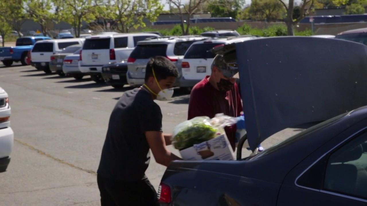 White Pony Express delivers surplus food from supermarkets and distributors to nearly 1,000 cars over the course of two days in Antioch, California.