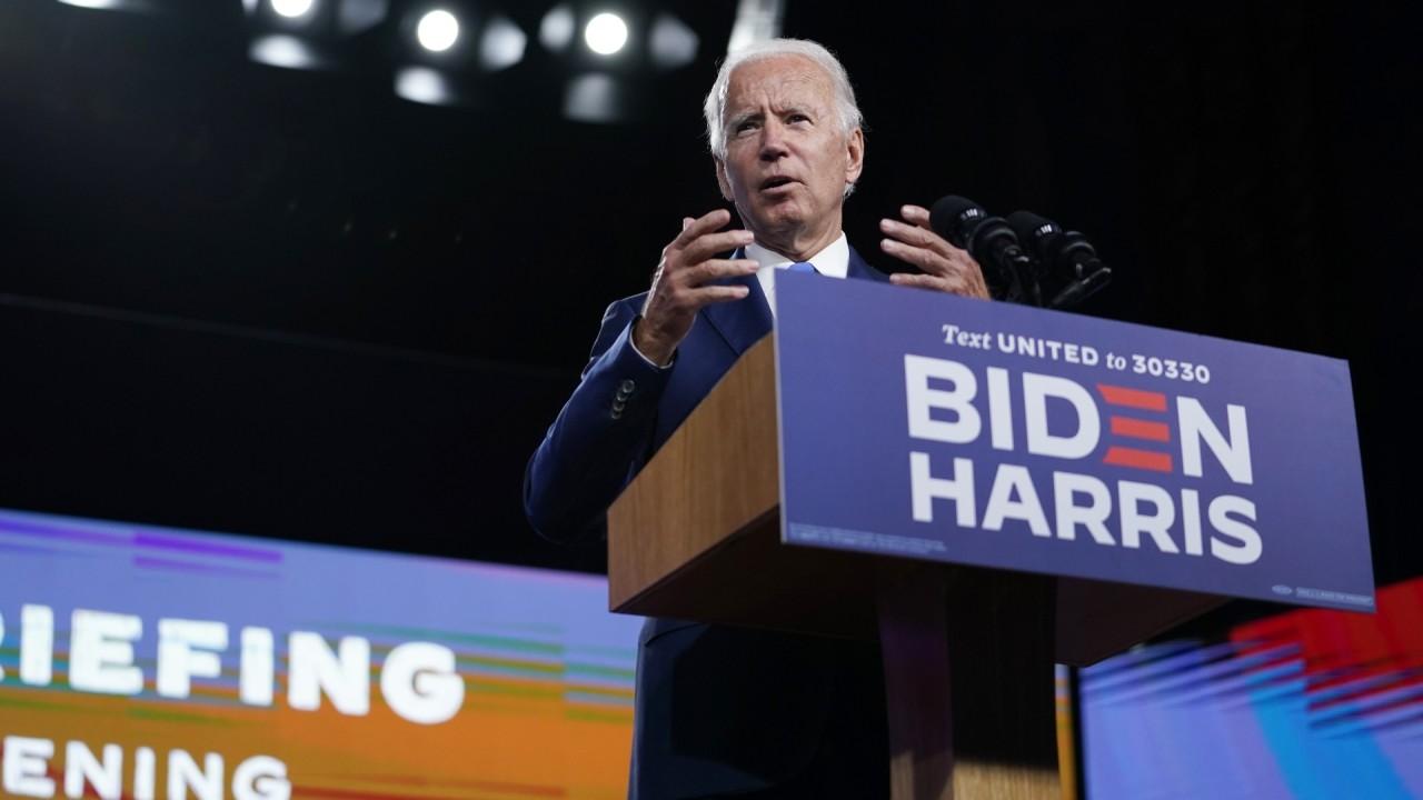 Democratic presidential nominee Joe Biden clarifies his stance on whether a second coronavirus lockdown is needed and his thoughts on a face mask mandate during a public event in Wilmington, Delaware, on Wednesday. 