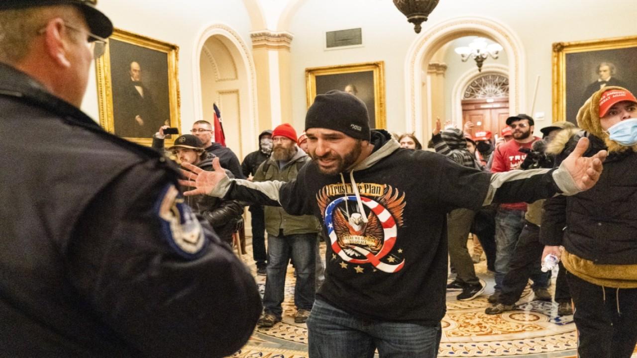 Rep. Markwayne Mullin of Oklahoma says he warned rioters through the doors inside the Capitol that they almost got shot by police and asked them 'is it worth it?'