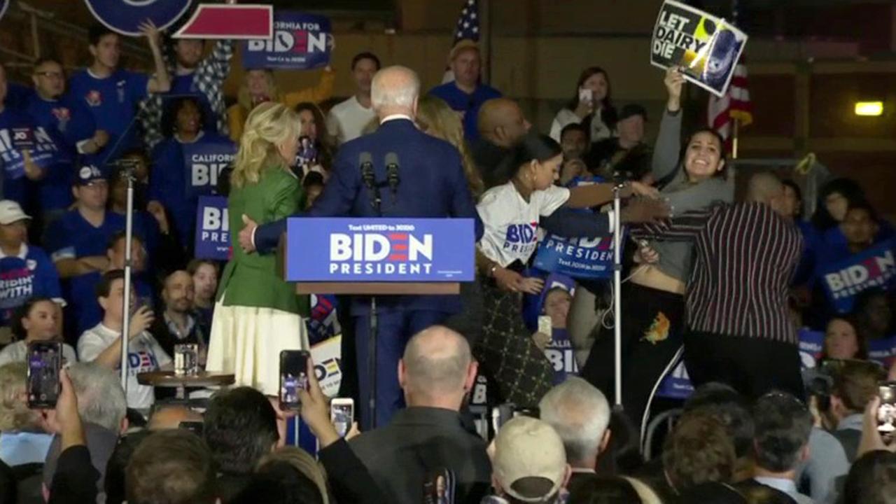Two dairy industry protesters interrupted former Vice President Joe Biden while he was speaking to supporters on Super Tuesday. 
